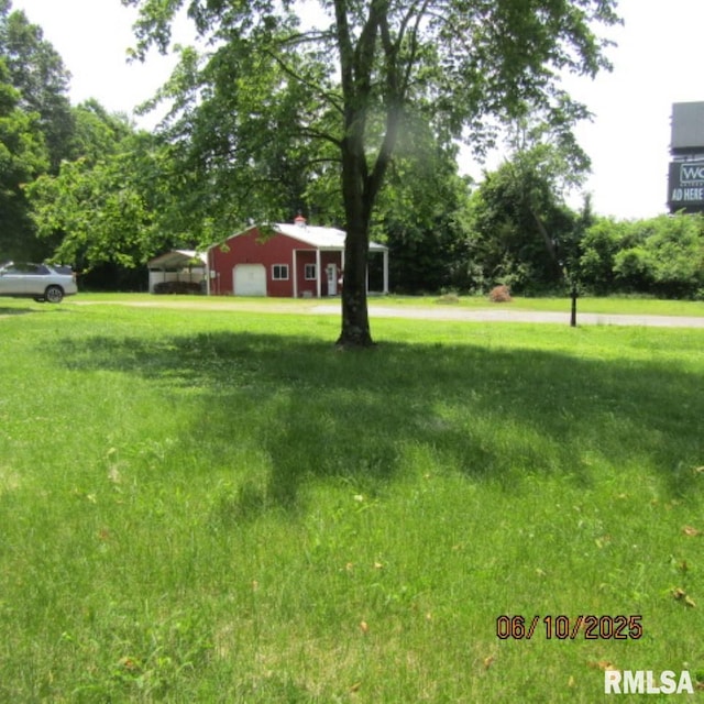 632 N Pershing St, Energy, IL 62933 - view of green lawn featuring a carport and view of scattered trees