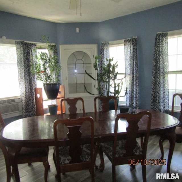 632 N Pershing St, Energy, IL 62933 - dining space with plenty of natural light, wood finished floors, and cooling unit