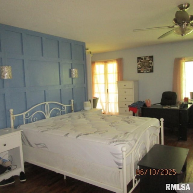 632 N Pershing St, Energy, IL 62933 - bedroom with dark wood-style flooring, multiple windows, and a ceiling fan