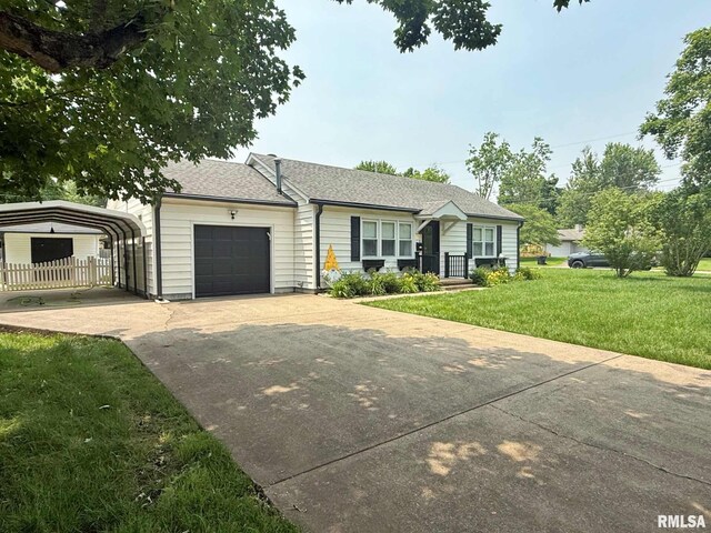 2223 N Ave, Metropolis, IL 62960 - ranch-style home featuring a carport, a front yard, concrete driveway, a garage, and a shingled roof