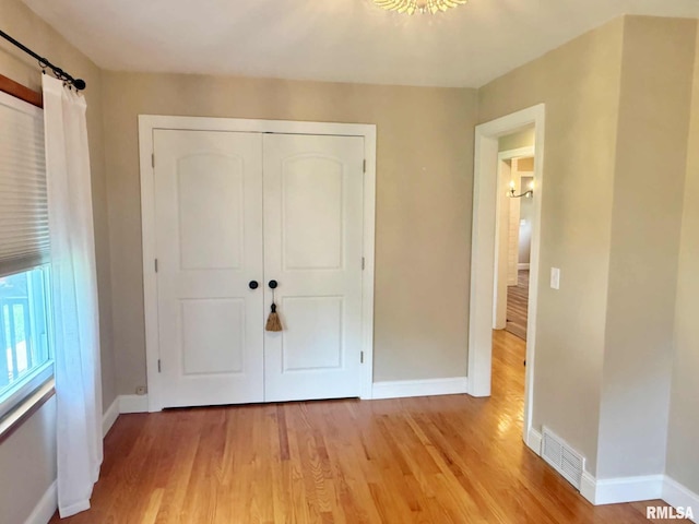 2223 N Ave, Metropolis, IL 62960 - unfurnished bedroom featuring light wood finished floors and a closet