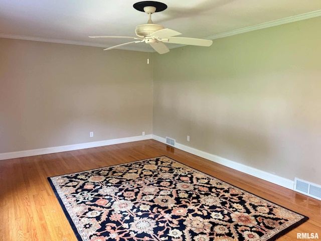 2223 N Ave, Metropolis, IL 62960 - unfurnished room featuring ornamental molding, a ceiling fan, and wood finished floors