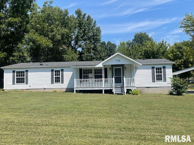 715 Wastena St, Benton, IL 62812 - manufactured / mobile home with covered porch, crawl space, a front lawn, and a shingled roof