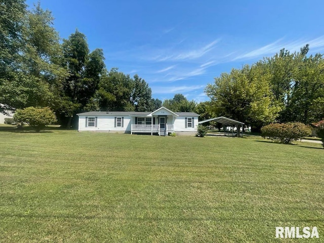 715 Wastena St, Benton, IL 62812 - manufactured / mobile home featuring a carport and a front lawn