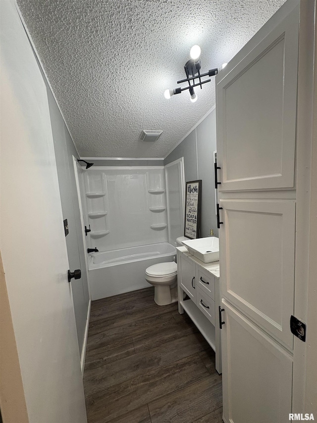 715 Wastena St, Benton, IL 62812 - full bath featuring a textured ceiling, wood finished floors, shower / tub combination, vanity, and lofted ceiling