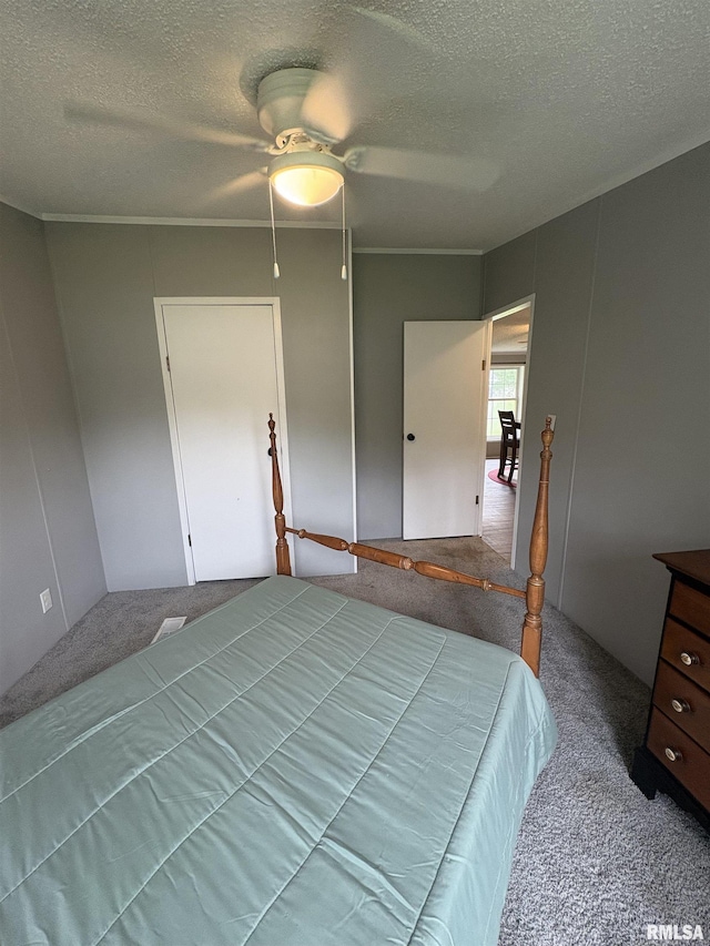 715 Wastena St, Benton, IL 62812 - carpeted bedroom featuring a textured ceiling and a ceiling fan