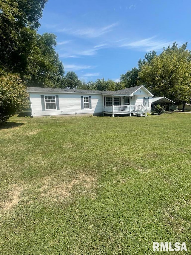 715 Wastena St, Benton, IL 62812 - view of front of property featuring a front lawn and a wooden deck
