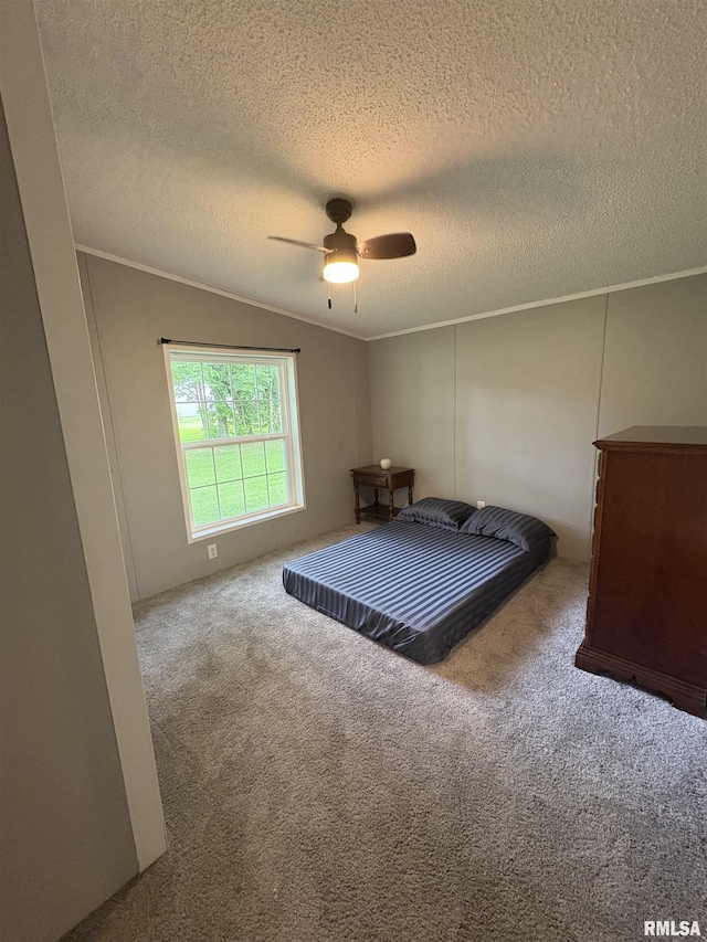 715 Wastena St, Benton, IL 62812 - bedroom featuring carpet floors, a textured ceiling, a ceiling fan, crown molding, and vaulted ceiling