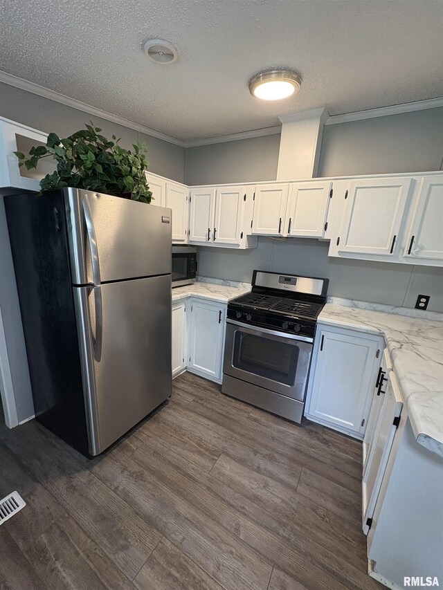 715 Wastena St, Benton, IL 62812 - kitchen with appliances with stainless steel finishes, white cabinetry, crown molding, a textured ceiling, and dark wood-style flooring