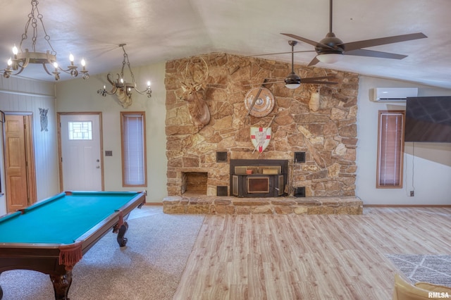 2036 Spruce St, Murphysboro, IL 62966 - playroom with a wall unit AC, a chandelier, vaulted ceiling, ceiling fan, and wood finished floors