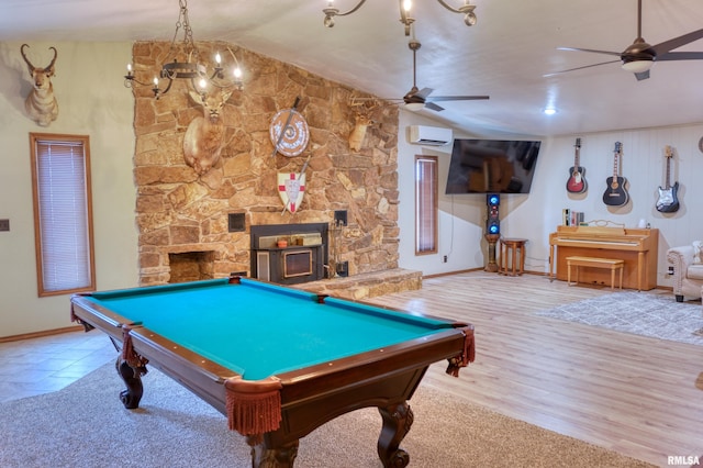 2036 Spruce St, Murphysboro, IL 62966 - playroom with a ceiling fan, a wall unit AC, vaulted ceiling, billiards, and a stone fireplace
