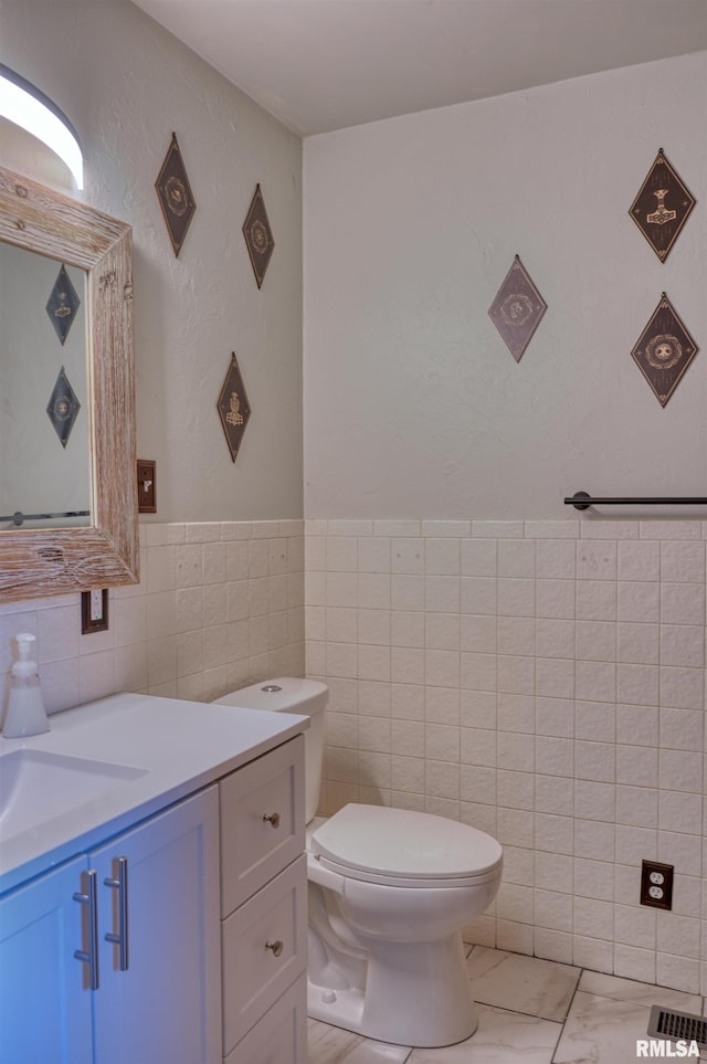 2036 Spruce St, Murphysboro, IL 62966 - bathroom with vanity, tile walls, and marble finish flooring
