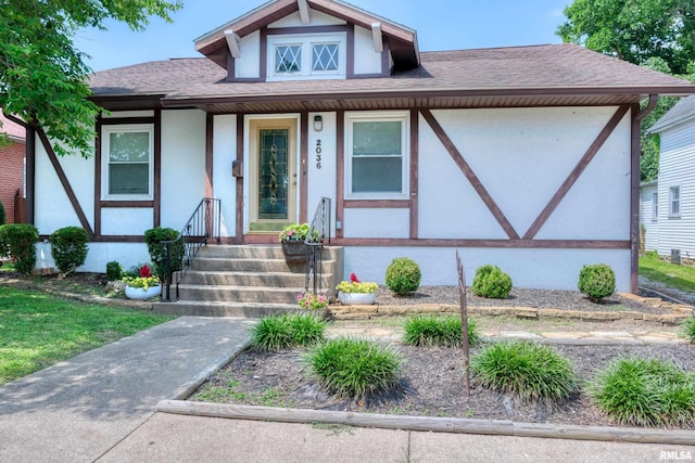 2036 Spruce St, Murphysboro, IL 62966 - tudor house with a shingled roof and stucco siding