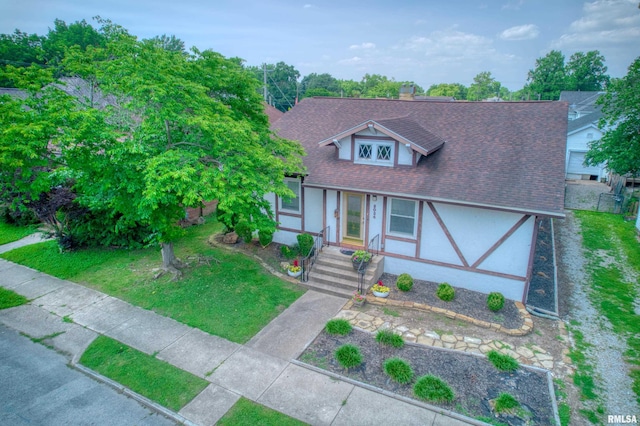 2036 Spruce St, Murphysboro, IL 62966 - view of front of home featuring roof with shingles, stucco siding, and a front yard
