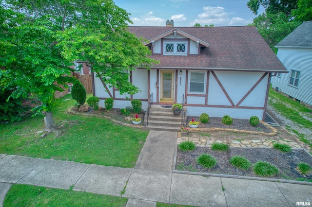 2036 Spruce St, Murphysboro, IL 62966 - view of front of home with stucco siding, a porch, a shingled roof, and a front yard