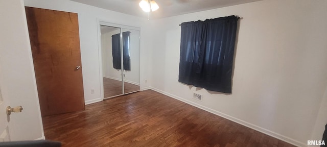 2903 Logan St, Mount Vernon, IL 62864 - unfurnished bedroom featuring a closet, wood finished floors, and a ceiling fan