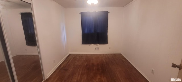 2903 Logan St, Mount Vernon, IL 62864 - unfurnished room with dark wood-type flooring and baseboards