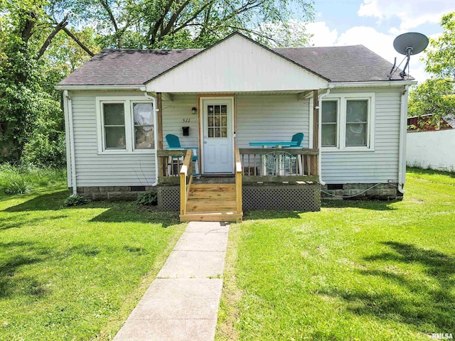 511 W 4th St, Flora, IL 62839 - bungalow-style home featuring roof with shingles, crawl space, and covered porch