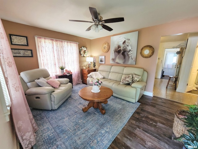 511 W 4th St, Flora, IL 62839 - living room featuring a ceiling fan and wood finished floors