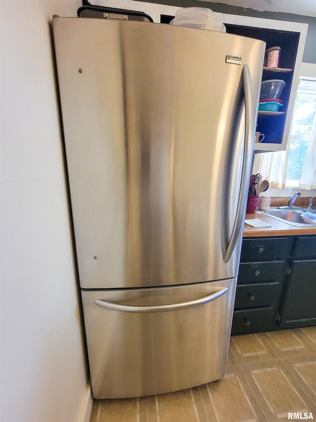 511 W 4th St, Flora, IL 62839 - kitchen view of freestanding refrigerator and a sink