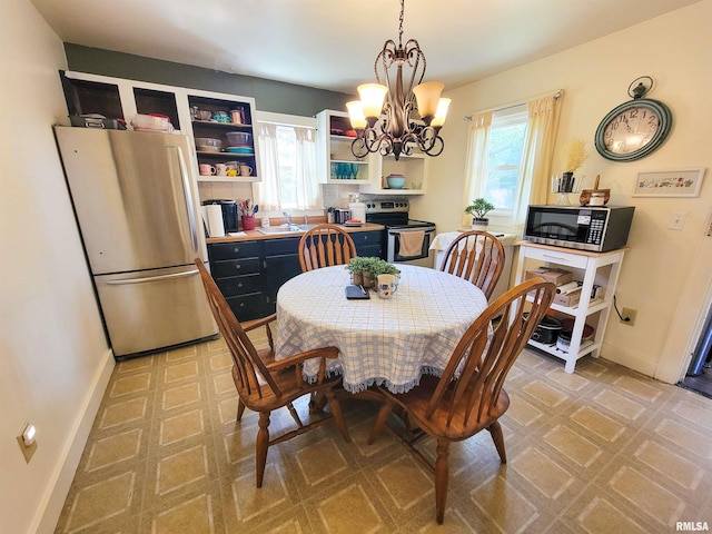 511 W 4th St, Flora, IL 62839 - dining area with a chandelier and light flooring