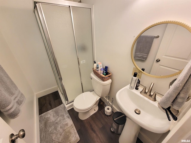 511 W 4th St, Flora, IL 62839 - full bath featuring a shower stall and wood finished floors