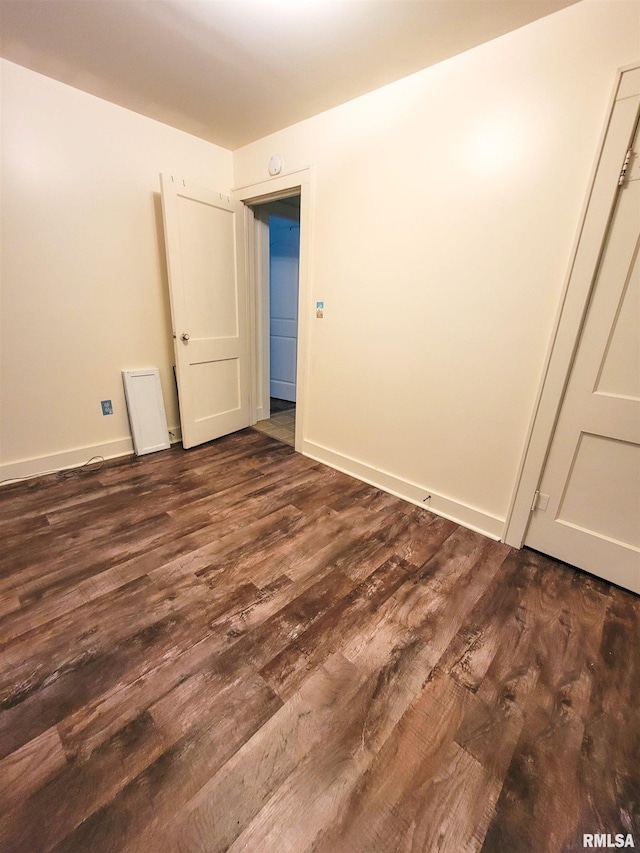 511 W 4th St, Flora, IL 62839 - unfurnished room with dark wood finished floors