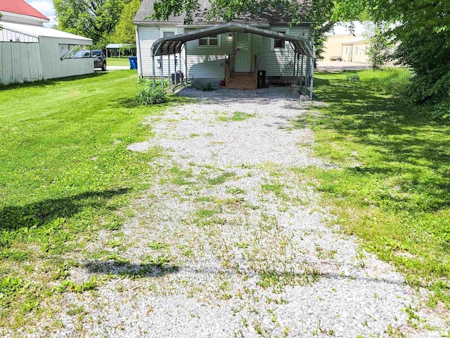 511 W 4th St, Flora, IL 62839 - view of green lawn with driveway