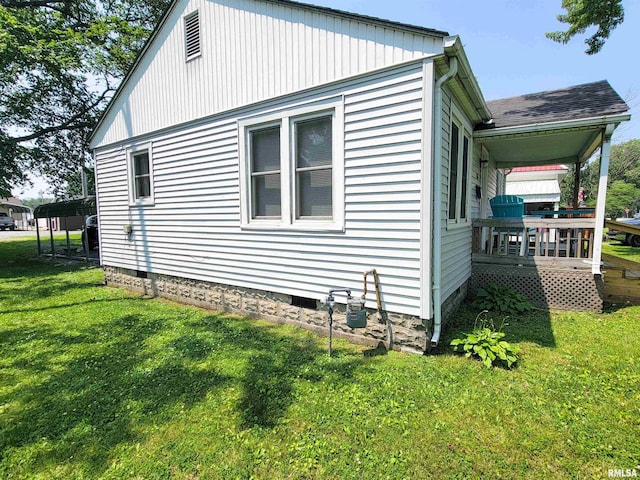 511 W 4th St, Flora, IL 62839 - view of side of home with a lawn, a wooden deck, and crawl space