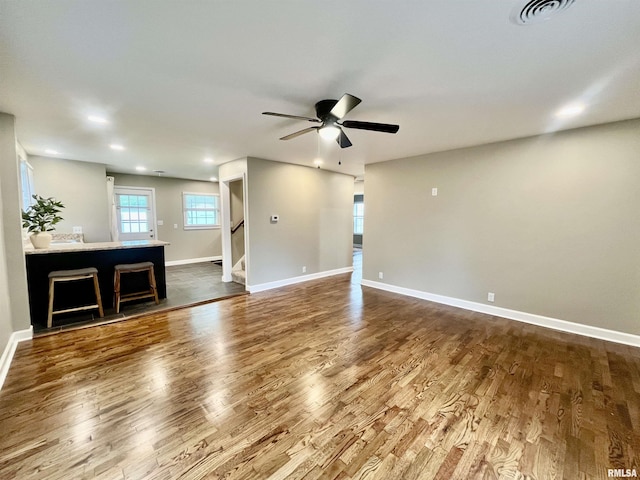 314 W 12th St, Metropolis, IL 62960 - unfurnished living room featuring a ceiling fan, stairs, dark wood-style floors, and recessed lighting