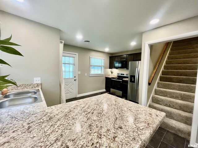 314 W 12th St, Metropolis, IL 62960 - kitchen with appliances with stainless steel finishes, a peninsula, and recessed lighting