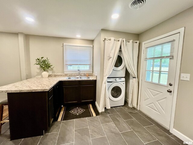 314 W 12th St, Metropolis, IL 62960 - laundry area featuring stacked washing machine and dryer and recessed lighting