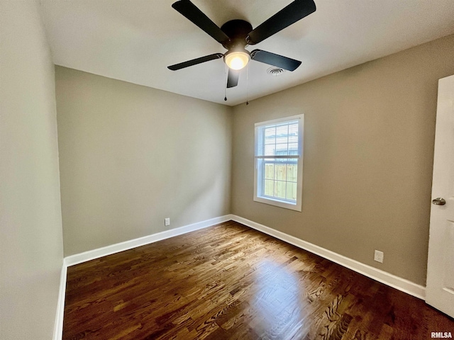 314 W 12th St, Metropolis, IL 62960 - spare room featuring ceiling fan and dark wood-type flooring