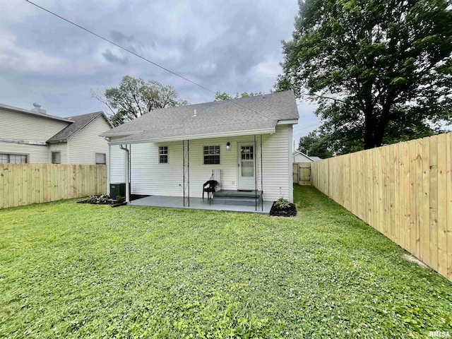 314 W 12th St, Metropolis, IL 62960 - rear view of property with a patio area and a fenced backyard