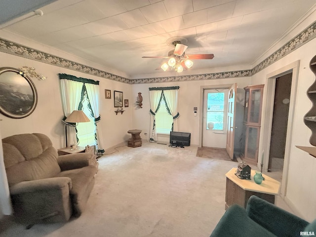 306 E 5th St, West Frankfort, IL 62896 - living room featuring ceiling fan, light colored carpet, and ornamental molding