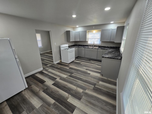 832 Fairfield Rd, Mount Vernon, IL 62864 - kitchen featuring white appliances, gray cabinetry, recessed lighting, dark wood finished floors, and dark stone countertops