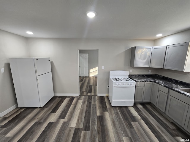 832 Fairfield Rd, Mount Vernon, IL 62864 - kitchen featuring white appliances, dark wood-style floors, gray cabinets, recessed lighting, and dark stone countertops