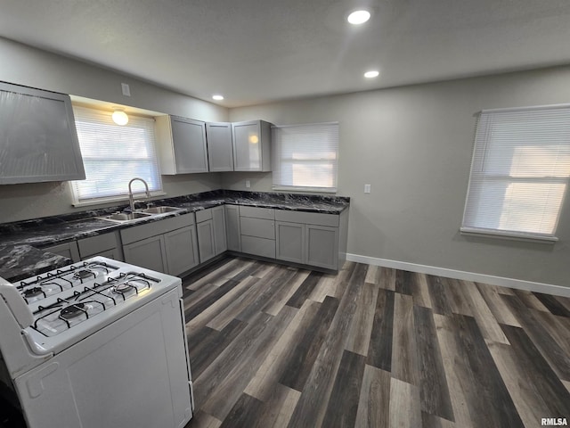 832 Fairfield Rd, Mount Vernon, IL 62864 - kitchen with white gas range, gray cabinetry, dark wood finished floors, and recessed lighting