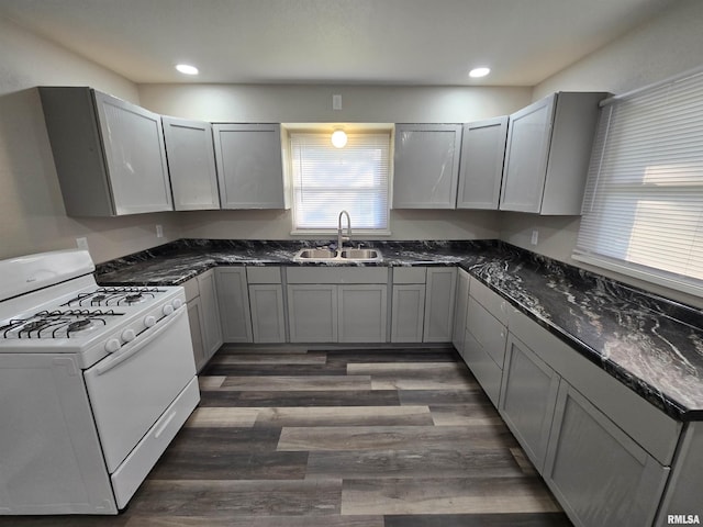 832 Fairfield Rd, Mount Vernon, IL 62864 - kitchen with white gas stove, gray cabinetry, dark stone counters, dark wood-style floors, and recessed lighting
