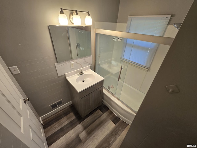 832 Fairfield Rd, Mount Vernon, IL 62864 - full bath with vanity, wood finished floors, and shower / bath combination with glass door