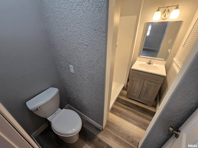 832 Fairfield Rd, Mount Vernon, IL 62864 - bathroom with wood finished floors, vanity, and a textured wall
