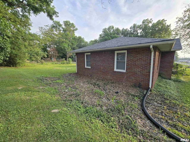 832 Fairfield Rd, Mount Vernon, IL 62864 - view of property exterior with brick siding, a lawn, and a shingled roof