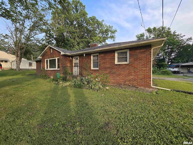 832 Fairfield Rd, Mount Vernon, IL 62864 - ranch-style home featuring brick siding, a front lawn, and a chimney