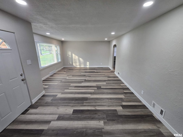 832 Fairfield Rd, Mount Vernon, IL 62864 - foyer entrance featuring recessed lighting, a textured wall, wood finished floors, arched walkways, and a textured ceiling