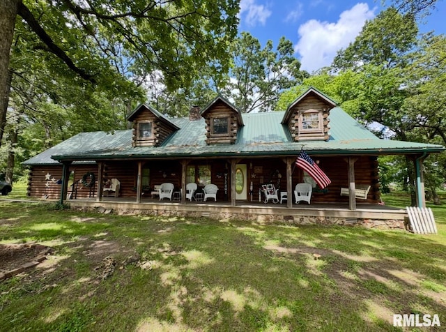9596 Fox Hunters Rd, Benton, IL 62812 - log home with covered porch, log siding, and a front lawn