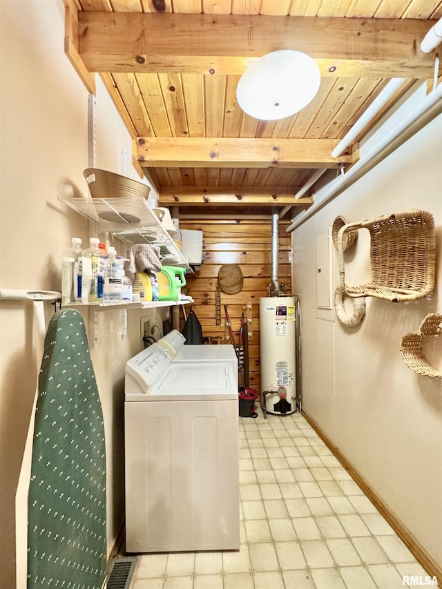 9596 Fox Hunters Rd, Benton, IL 62812 - laundry area with gas water heater, wood ceiling, light floors, washer and dryer, and wooden walls