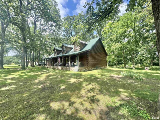 9596 Fox Hunters Rd, Benton, IL 62812 - view of side of property with a yard, log exterior, and a porch