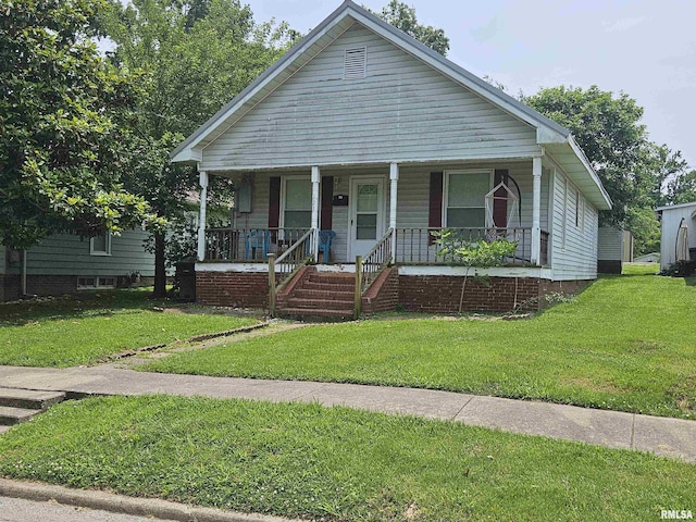 123 W College St, Harrisburg, IL 62946 - bungalow-style home with covered porch and a front yard
