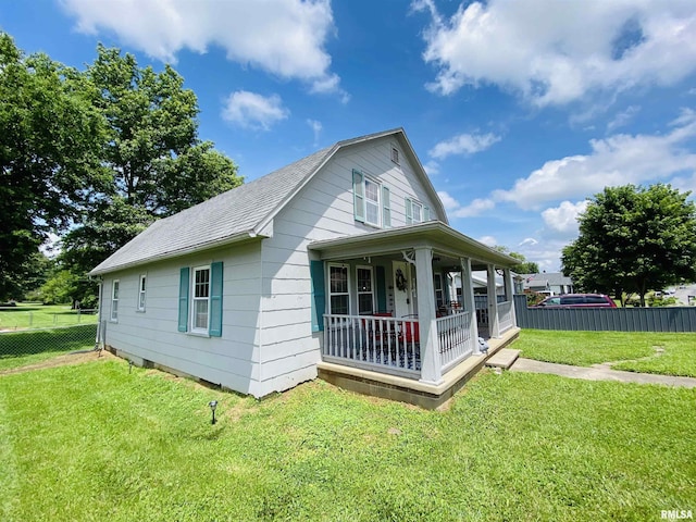 245 W Mcclernand Ave, Shawneetown, IL 62984 - view of property exterior featuring covered porch and roof with shingles