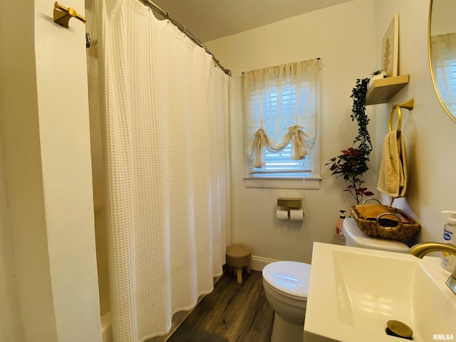 245 W Mcclernand Ave, Shawneetown, IL 62984 - bathroom featuring wood finished floors, shower / bathtub combination with curtain, and vanity